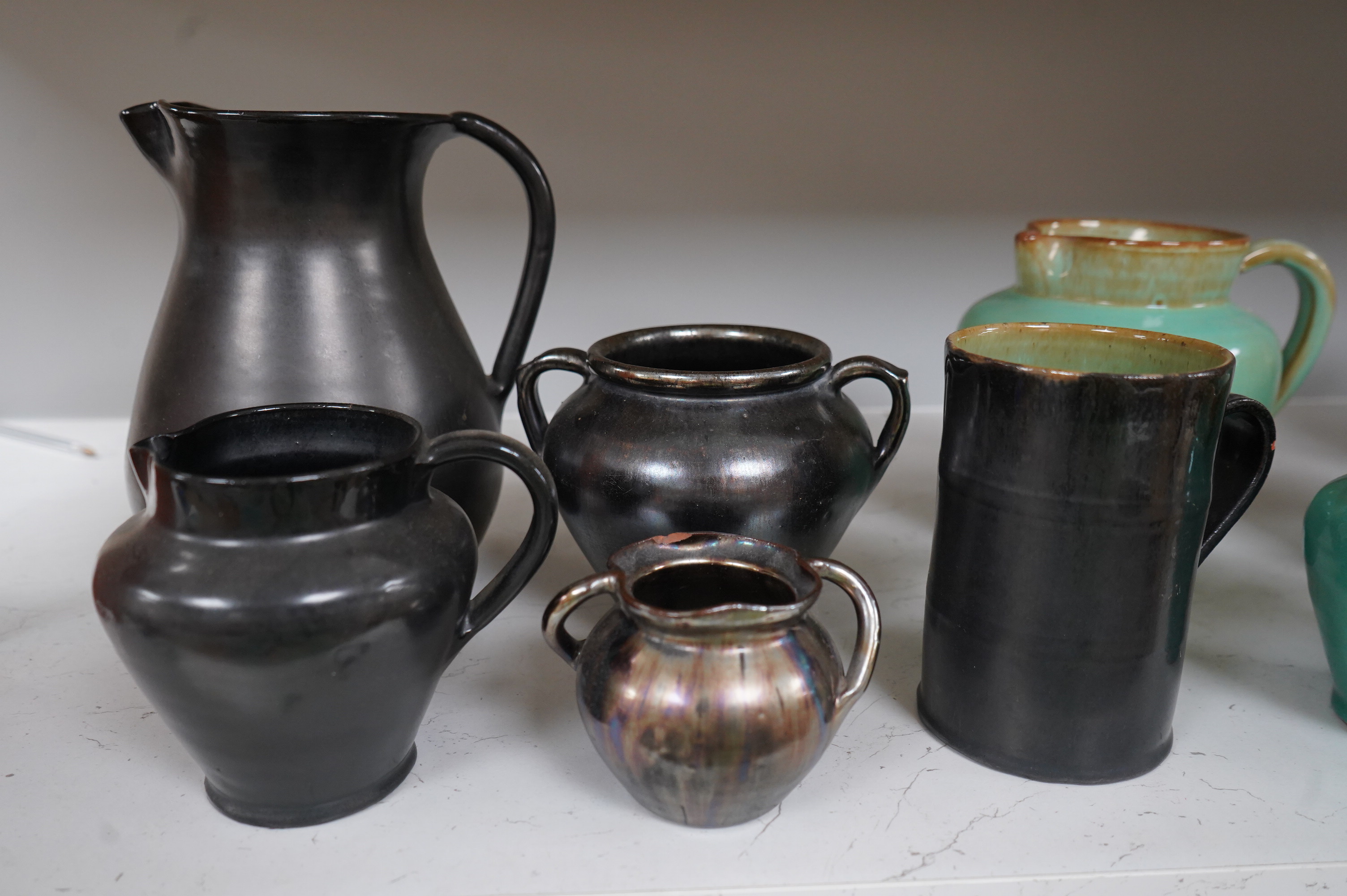 Ten items of Dickerware pottery, including a Uriah Clark and Nephew trio of connected jugs, tallest 21cm